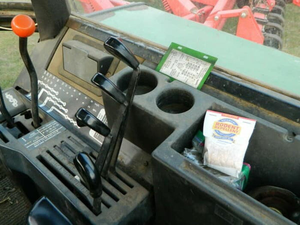 Rodent repellent pouch on dashboard