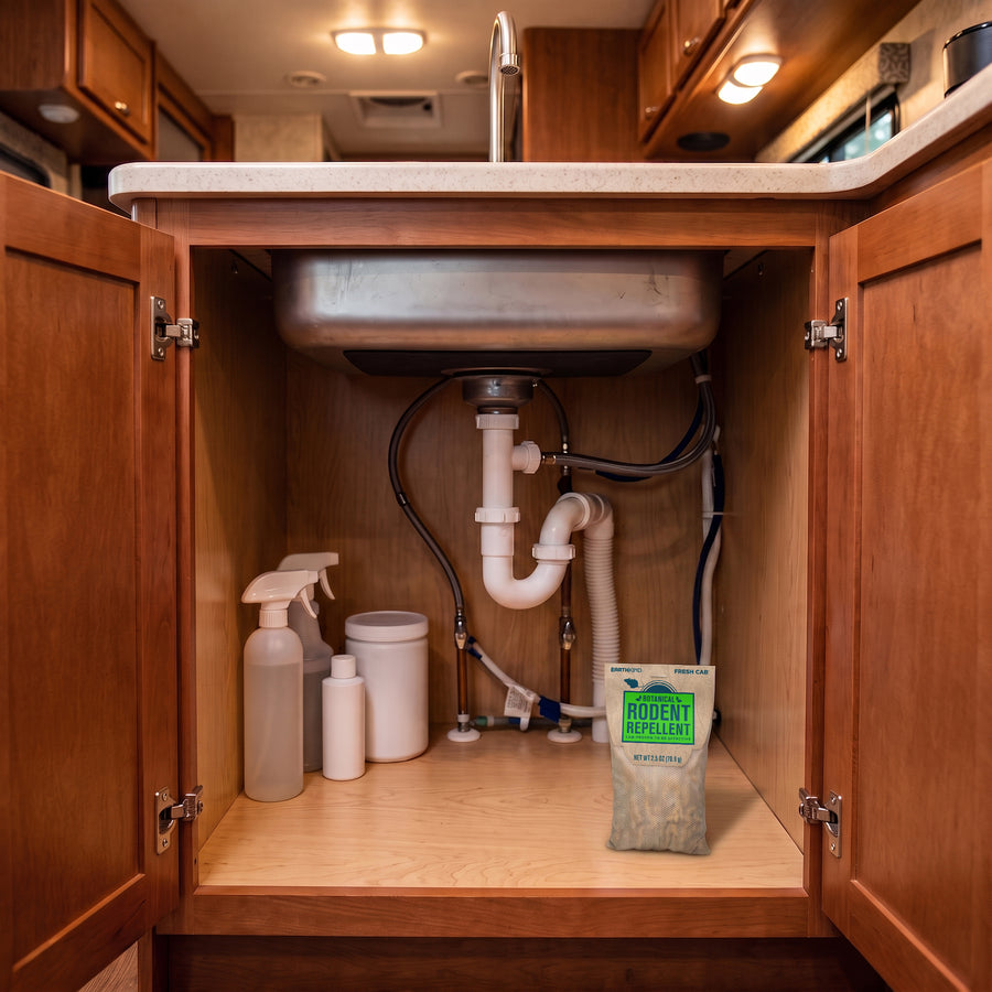 Open RV galley cabinet or pantry with dry goods
