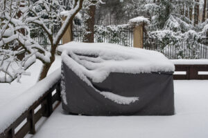 Outdoor furniture cover with snow on top