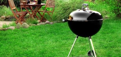 image of barbecue grill on grassy lawn