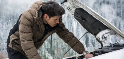 Man inspecting Car Engine